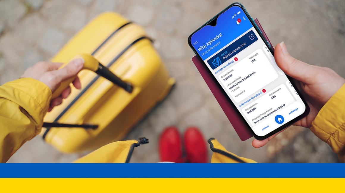 telefon z receptą, w tle walizka, ukr