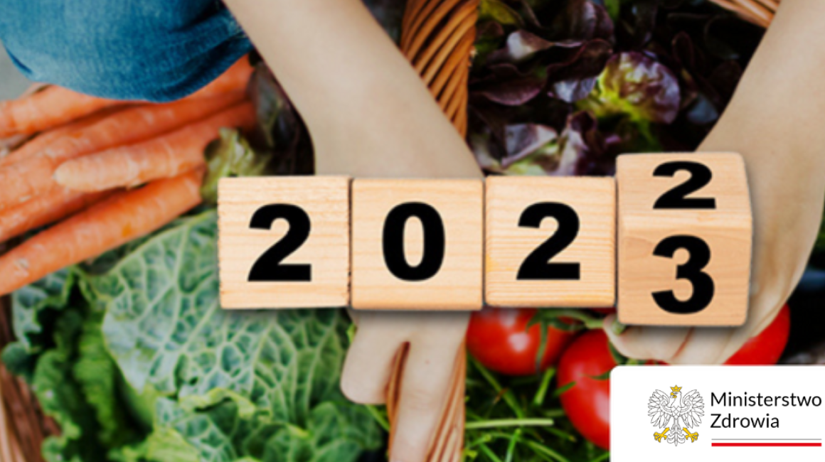 warzywa dłonie i napis 2023