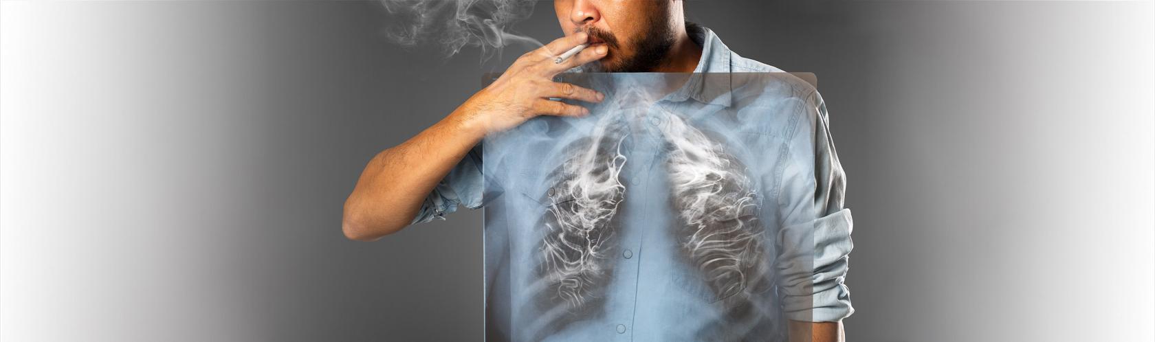 Mężczyzna pali papierosa, widzimy jego płuca, a w nich dym