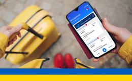 telefon z receptą, w tle walizka, ukr